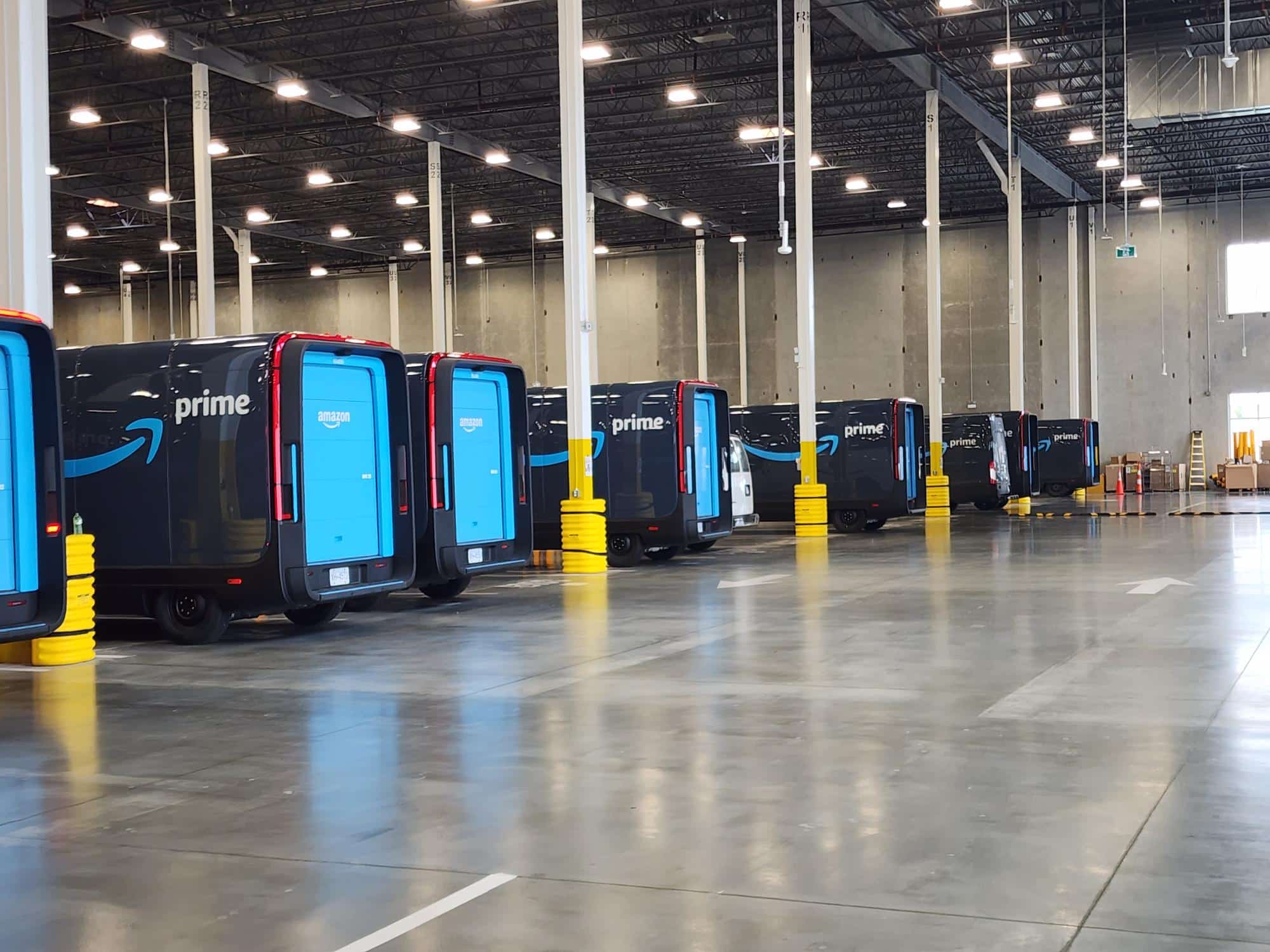Amazon's electric delivery vehicles parked in a warehouse in Delta BC.